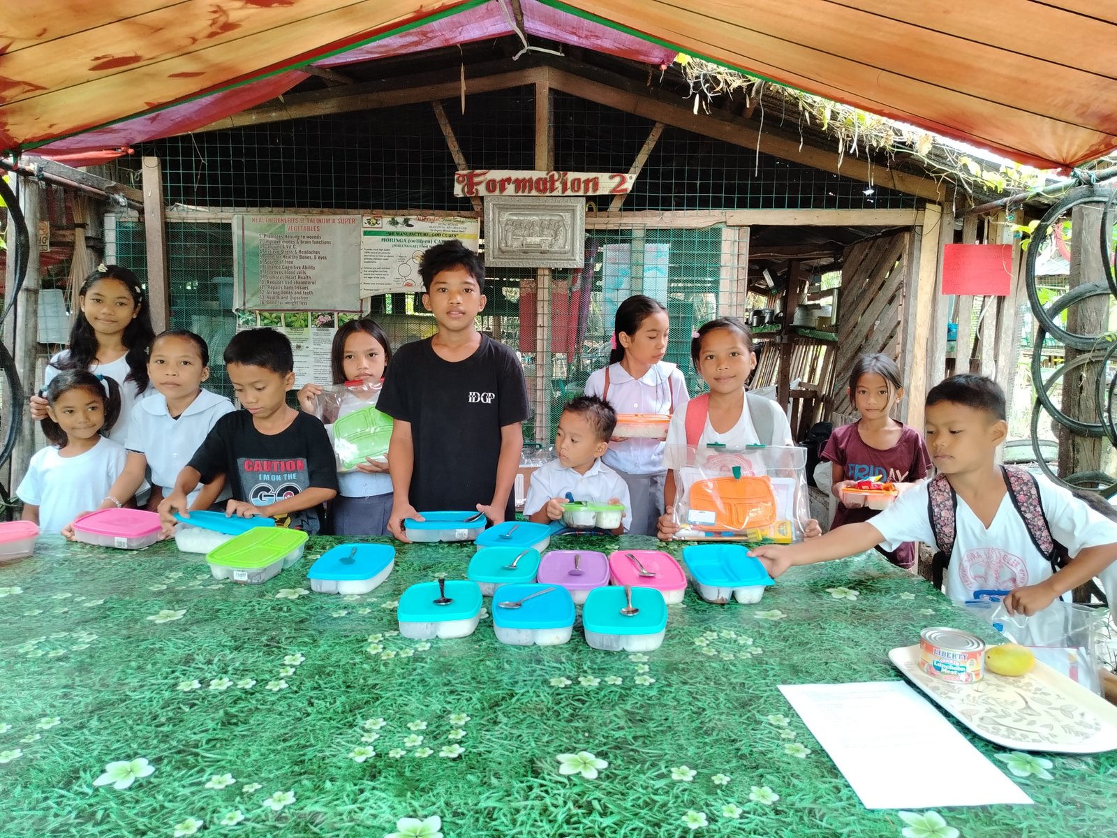 Children sharing a meal at the farm pavilion